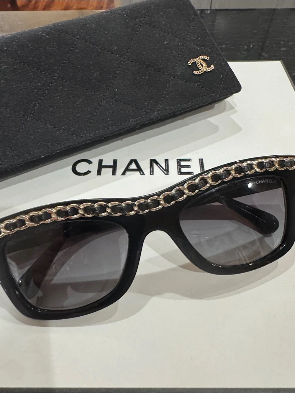 CHANEL Black Cat-Eye Sunglasses with Gold Chain Trim